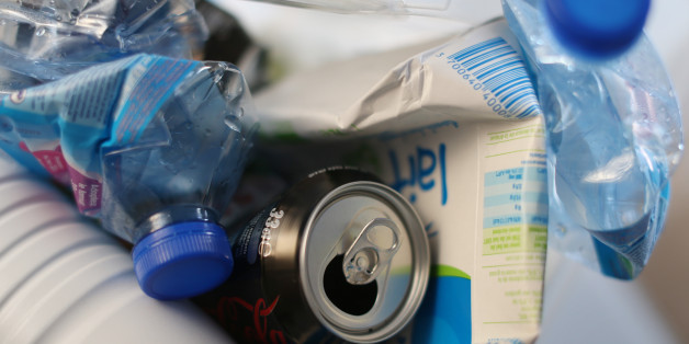 Water and milk bottles and cans are seen in a selectif sorting trash bin before been recycling, in Paris on March 18, 2013. AFP PHOTO THOMAS SAMSON (Photo credit should read THOMAS SAMSON/AFP/Getty Images)
