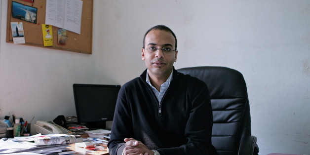 This Dec. 7, 2011 photo, shows Hossam Bahgat in his office at the Egyptian Initiative for Personal Rights in Garden City, Cairo, Egypt. Lawyers for Bahgat, a leading Egyptian investigative journalist and human rights advocate said Monday, Nov. 9, 2015 that the Egyptian military is holding him in an undisclosed location while he faces charges of spreading âfalse news.â Bahgat was detained Sunday after being summoned to an intelligence building in Cairo. (AP Sarah Rafea via AP) MANDATORY
