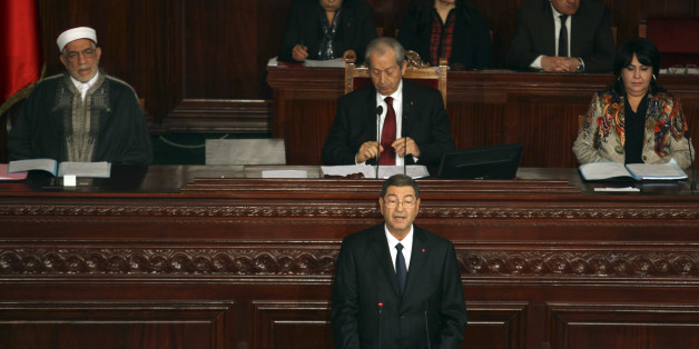 Tunisian Prime Minister Habib Essid delivers his speech at the national assembly in Tunis, Wednesday, Feb.4, 2015. The government faces a confidence vote in parliament on Wednesday, which it is expected to pass. The new government faces a battle against high inflation and high unemployment. (AP Photo/Hassene Dridi)
