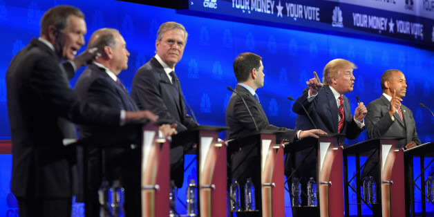 John Kasich, left, and Donald Trump, second from right, argue across fellow candidates during the CNBC Republican presidential debate at the University of Colorado, Wednesday, Oct. 28, 2015, in Boulder, Colo. (AP Photo/Mark J. Terrill)
