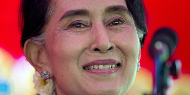 Myanmar's opposition leader Aung San Suu Kyi addresses the media at a press conference at her home in Yangon, Myanmar, Thursday, Nov. 5, 2015. On Sunday Myanmar will hold what is being viewed as the country's best chance for a free and credible election in a quarter of a century.(AP Photo/Mark Baker)