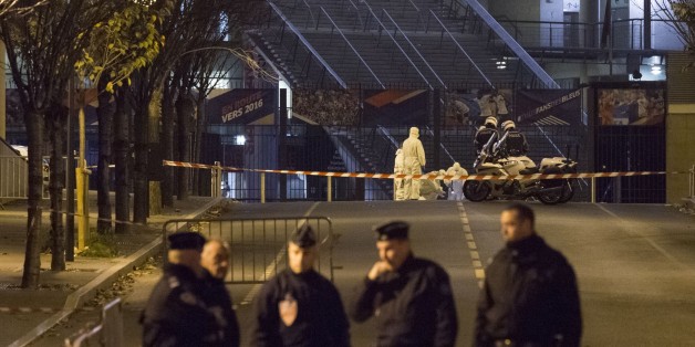 PARIS, FRANCE - NOVEMBER 13: French officials work outside the Stade de France, where France was hosting Germany in an international football friendly, after deadly shootings and explosions took place in several neighbourhoods of Paris on November 13, 2015. Reports indicate that more than 140 people overall have been killed in at least two suicide bombings, another explosion and a drive-by shooting, which targeted seven different locations. (Photo by Geoffroy Van der Hasselt/Anadolu Agency/Getty