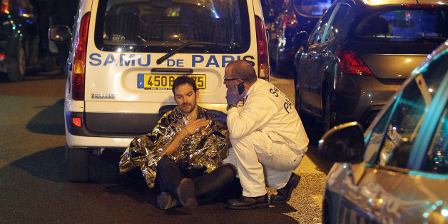 Police officers stand guard outside the Stade de France stadium after an explosion and after international friendly soccer match France against Germany, in Saint Denis, outside Paris, early Saturday Nov. 14, 2015. Multiple fatal attacks throughout the city have prompted President Francois Hollande to announce he was closing the country's borders and declaring a state of emergency. (AP Photo/Michel Spingler)