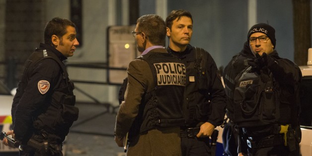 PARIS, FRANCE - NOVEMBER 13: French officials work outside the Stade de France, where France was hosting Germany in an international football friendly, after deadly shootings and explosions took place in several neighbourhoods of Paris on November 13, 2015. Reports indicate that more than 140 people overall have been killed in at least two suicide bombings, another explosion and a drive-by shooting, which targeted seven different locations. (Photo by Geoffroy Van der Hasselt/Anadolu Agency/Getty Images)