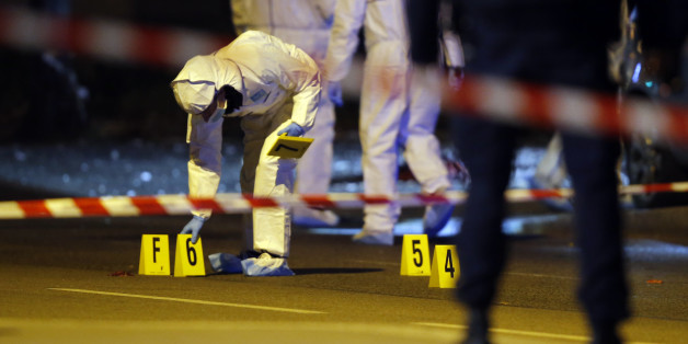 A French police officer patrols at the France Italy border in La Turbie, southeastern France, Saturday, Nov. 14, 2015. French President Francois Hollande said more than 120 people died Friday night in shootings at Paris cafes, suicide bombings near France's national stadium and a hostage-taking slaughter inside a concert hall. (AP Photo/Lionel Cironneau)