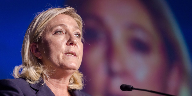 President of France's far right National Front party Marine Le Pen talks during a meeting organised by Flemish far right party Flemish Interest, at the Flemish Parliament in Brussels on Tuesday, Sept. 15, 2015. (AP Photo/Geert Vanden Wijngaert)