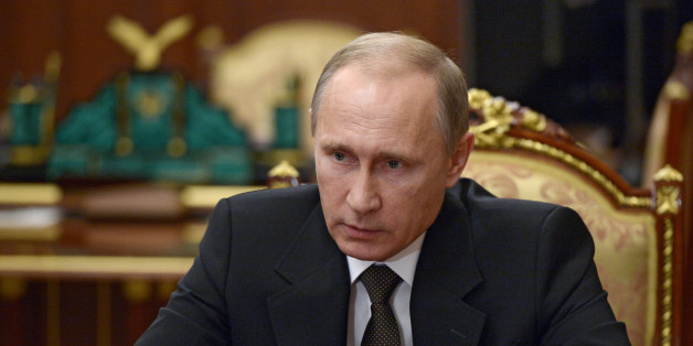 Russian President Vladimir Putin heads a meeting on Russian plane crash in Egypt in Moscow's Kremlin, Russia, early Tuesday, Nov. 17, 2015. The head of Russia's FSB security service says the crash of the passenger plane in Egypt was the result of a 'terrorist' act. Alexander Bortnikov told Putin on Tuesday that a homemade explosive device blew up on the plane. All 224 people on board the plane, most of them Russian tourists, were killed in the Oct. 31 crash. (Alexei Nikolsky/SPUTNIK, Kremlin Poo