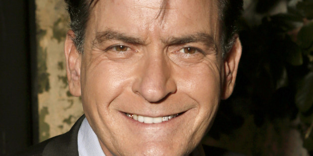 FILE - This June 26, 2012 file photo shows actor Charlie Sheen attending the FX Summer Comedies Party at Lure in Los Angeles. The actor announced Monday, July 16, that he'll donate at least $1 million to the USO in what is believed to be among the largest single donation ever given to the troop morale-boosting organization. He says he'll donate 1 percent of profits from his new FX show âAnger Managementâ to the group, known for sending entertainers to lighten the hearts of troops. He'l