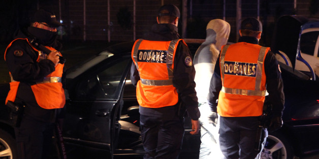 French custom officers check vehicles at the border crossing between France and Belgium in Neuville-en-Ferrain, northern France, as part of the hunt for fugitives wanted in connection with Fridayâs attacks, Tuesday, Nov. 17, 2015. France invoked a never-before-used European Union â mutual-defense clauseâ to demand Tuesday that its partners provide support for its operations against the Islamic State group in Syria and Iraq and other security missions in the wake of the Paris attac
