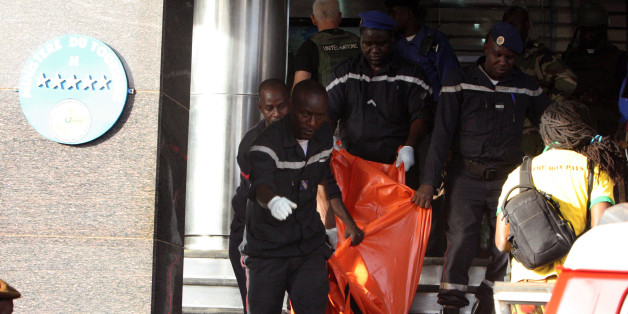 A body is removed from the Radisson Blu hotel, after it was stormed by gunmen during a attack on the hotel in Bamako, Mali, Friday, Nov. 20, 2015. Islamic extremists armed with guns and grenades stormed the luxury Radisson Blu hotel in Mali's capital Friday morning, and security forces worked to free guests floor by floor. (AP Photo/Harouna Traore)
