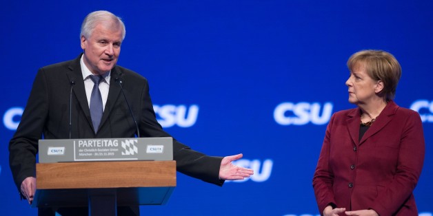 MUNICH, GERMANY - NOVEMBER 20: German Chancellor and Chairwoman of the German Christian Democrats (CDU) Angela Merkel (R) and Bavarian Governor and Chairman of the Bavarian Christian Democrats (CSU) Horst Seehofer (L) attend the annual CSU party congress in Munich, Germany on November 20, 2015. (Photo by Lukas Barth/Anadolu Agency/Getty Images)