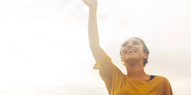Woman with hand in the air.