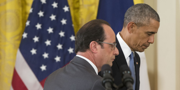 President Barack Obama and French President Francois Hollande walk off stage at the end of their news conference in the East Room of the White House in Washington, Tuesday, Nov. 24, 2015. Pledging solidarity after the Paris attacks, President Barack Obama promised Tuesday to work with France and other allies to intensify the U.S.-led campaign against the Islamic State, saying America will not be cowed by the scourge of terrorism. (AP Photo/Pablo Martinez Monsivais)