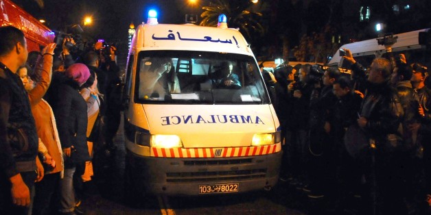 An ambulance rushes to the scene of a bus explosion in the center of the capital, Tunis, Tunisia, Tuesday, Nov. 24, 2015. An explosion hit a bus carrying members of Tunisiaâs presidential guard in the countryâs capital Tuesday, killing at least 12 people in what the Interior Ministry called a âterrorist actâ. (AP Photo/Hassene Dridi)