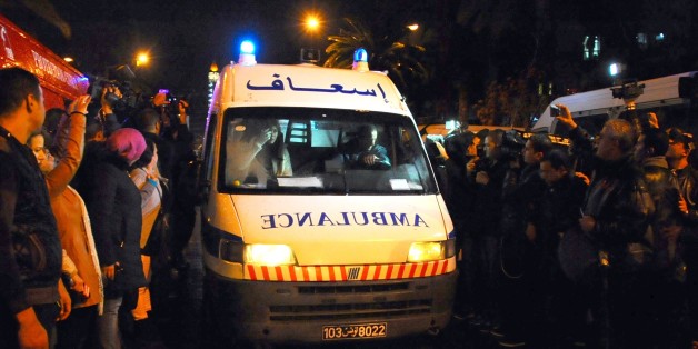 An ambulance rushes to the scene of a bus explosion in the center of the capital, Tunis, Tunisia, Tuesday, Nov. 24, 2015. An explosion hit a bus carrying members of Tunisiaâs presidential guard in the countryâs capital Tuesday, killing at least 12 people in what the Interior Ministry called a âterrorist actâ. (AP Photo/Hassene Dridi)