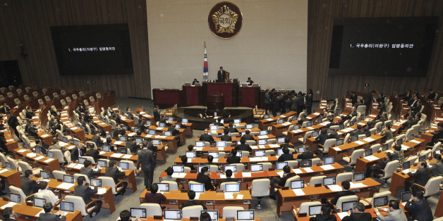 South Korean lawmakers attend to pass a confirmation of President Park Geun-hye's nomination of Lee Wan Koo as the country's prime minister during the plenary session at the National Assembly in Seoul, South Korea, Monday, Feb. 16, 2015. South Koreaâs ruling party-controlled legislature on Monday approved Parkâs choice for prime minister following fierce political wrangling over whether heâs fit for the countryâs No. 2 job. (AP Photo/Ahn Young-joon)