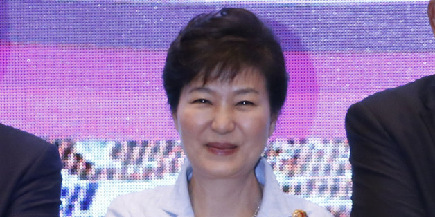South Korean President Park Geun-hye, second right, joins hands with Thailand's Prime Minister Prayuth Chan-o-cha, left, Vietnamese Prime Minister Nguyen Tan Dung, second left, and Malaysian Prime Minister Najib Razak for a group photo during 17th ASEAN Republic of Korea Summit in Kuala Lumpur, Malaysia Sunday, Nov. 22, 2015. (AP Photo/Vincent Thian)