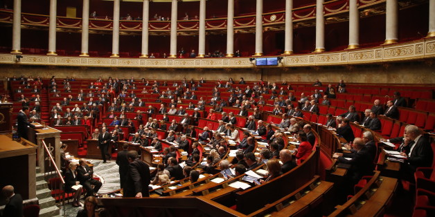 French Prime Minister Manuel Valls addresses the parliament at the national assembly in Paris, Thursday Nov.19,2015. Valls is warning that the associates of extremists who targeted France last week could use chemical and biological weapons, as he urged Parliament to extend a state of emergency. (AP Photo/Michel Euler)
