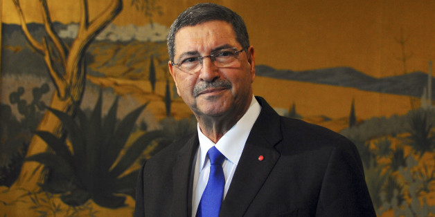 New Tunisian Prime Minister Habib Essid looks on after presenting his second government to the medias, Monday, Feb.2, 2015 in Tunis. Essid from the nationalist Nida Tunis party that won the most seats in October's election named a new Cabinet on Monday that included a single minister from the powerful Islamist Ennahda Party, Ziad Ladhari as minister of employment. (AP Photo/Hassene Dridi)