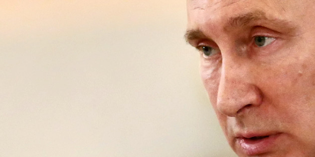 Russian President addresses newly arrived foreign ambassadors of 15 countries during receiving credentials ceremony in Moscow's Kremlin, Russia, Thursday, Nov. 26, 2015. Russia announced Wednesday it will deploy long-range air defense missiles to its base in Syria and destroy any target that may threaten its warplanes. The state-run RIA Novosti news agency on Thursday quoted its own reporter in Syria as saying S-400 missiles have been delivered. (Sergei Ilnitsky/Pool photo via AP)