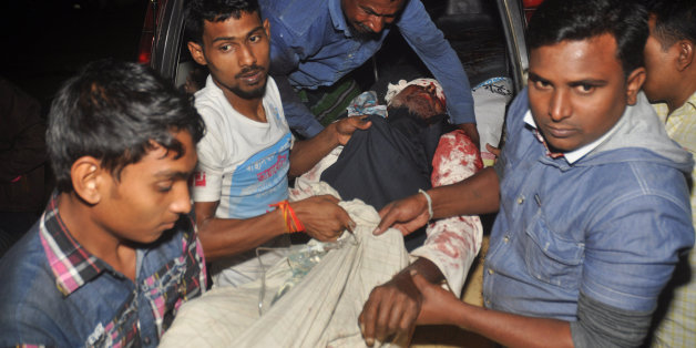A man injured in an attack on a Shiite mosque is carried for treatment in Bogra district, Bangladesh, Thursday, Nov. 26, 2015. Police say at least five unidentified assailants armed with fire arms have opened fire on devotees during evening prayer in a Shiite mosque in northern Bangladesh. Shiites are minority in Sunni-majority Bangladesh, a Muslim majority nation of 160 million people, where attacks on minorities in recent months allegedly by Islamist radicals have been almost regular. (AP Phot