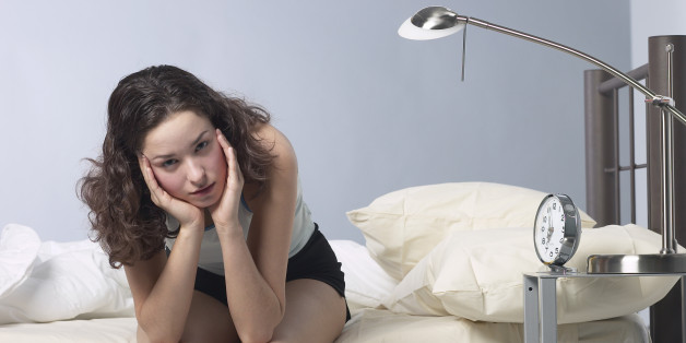Irritated girl on bed