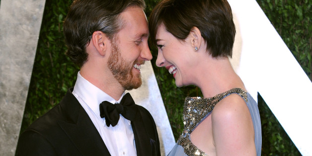 Anne Hathaway, right, and Adam Shulman arrive at the 2013 Vanity Fair Oscars Viewing and After Party on Sunday, Feb. 24 2013 at the Sunset Plaza Hotel in West Hollywood, Calif. (Photo by Jordan Strauss/Invision/AP)