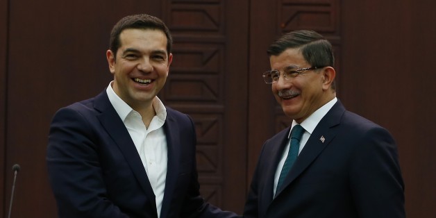ANKARA, TURKEY - NOVEMBER 18: Turkish Prime Minister Ahmet Davutoglu (R) and his Greek counterpart Alexis Tsipras (L) shake hands following a press conference at the Cankaya palace in Ankara, Turkey on November 18, 2015. (Photo by Murat Kaynak/Anadolu Agency/Getty Images)