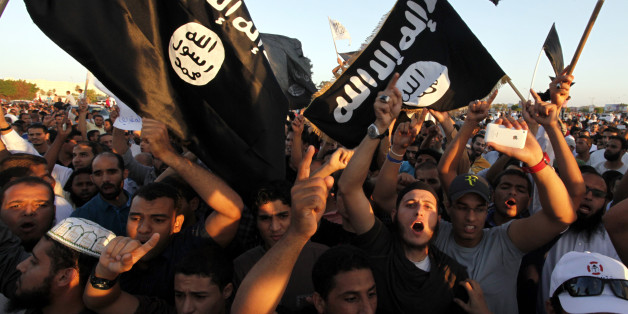 FILE - In this Friday, Sept. 21, 2012 file photo, Libyan followers of Ansar al-Shariah Brigades and other Islamic militias, hold a demonstration against a film and a cartoon denigrating the Prophet Muhammad in Benghazi. Libya, virtually a failed state the past years, has provided a perfect opportunity for the Islamic State group to expand from its heartland of Syria and Iraq to establish a strategic stronghold close to European shores. (AP Photo, File)