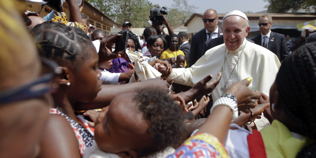 Pope Francis is cheered by locals as he visits a refugee camp, in Bangui, Central African Republic, Sunday, Nov. 29, 2015. The Pope has landed in the capital of Central African Republic, his final stop in Africa and where he will seek to heal a country wracked by conflict between Muslims and Christians. (AP Photo/Andrew Medichini)