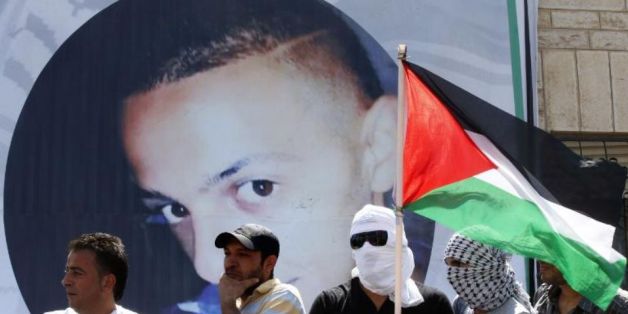 Portrait de Mohammed Abou Khdeir, lors de ses funérailles à Jérusalem-Est, le 4 juillet 2014