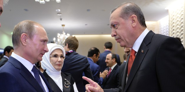 Russian President Vladimir Putin, left, listens to Turkish President Recep Tayyip Erdogan as they meet each other during the opening ceremony of the 2015 European Games in Baku, Azerbaijan, Friday, June 12, 2015. (RIA-Novosti, Kremlin Pool Photo via AP)
