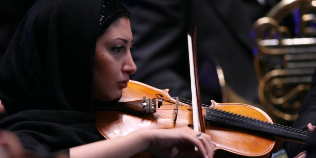 A member of Tehran Symphony Orchestra plays during Asian Mayors Forum in Tehran on Wednesday Oct, 19, 2008.(AP photo/Hasan Sarbakhshian)