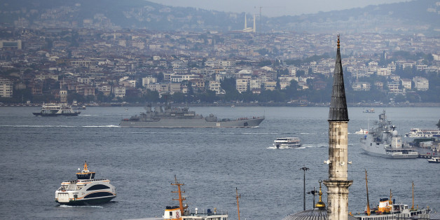 A Russian warship passes through the Bosphorus, in Istanbul, en route to the Mediterranean Sea, Tuesday, Oct. 6, 2015. Russia began launching military operations in Syria on Wednesday, targeting mainly central and northwestern Syria, strategic regions that are the gateway to its long-term ally President Bashar Assad's main strongholds. (AP Photo)
