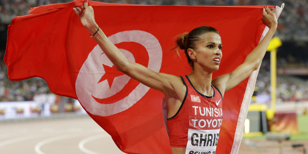 Tunisia's Habiba Ghribi celebrates after winning a silver medal in the women's 3000m steeplechase final at the World Athletics Championships at the Bird's Nest stadium in Beijing, Wednesday, Aug. 26, 2015. (AP Photo/Kin Cheung)