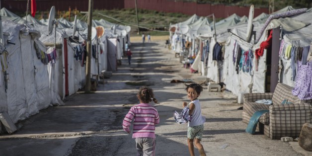 HATAY, TURKEY - OCTOBER 25: Syrian refugee kids, fled from their homes due to civil war in their homeland, play in Yayladagi YIBO camp in Hatay province of Turkey, on October 25, 2015. (Photo by Fatih Aktas/Anadolu Agency/Getty Images)