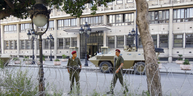 Tunisian soldiers walk around in front of Tunisian Interior Minister in Tunis, Thursday Oct. 20, 2011. Tunisia landmark Oct. 23 election for a constitutional body will determine the future of this North African nation which overthrew its longtime dictator in January. (AP Photo/Francois Mori)
