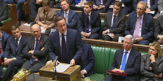 British Prime Minister David Cameron talks to lawmakers inside the House of Commons in London during a debate on launching airstrikes against Islamic State extremists inside Syria, Wednesday, Dec. 2, 2015. The parliamentary vote is expected Wednesday evening. (Parliamentary Recording Unit via AP Video) TV OUT - NO ARCHIVE