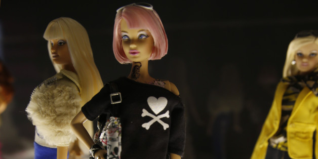 Barbie dolls are displayed at the 'Barbie Icon' exhibition, at Mudec (Museum pf Cultures), in Milan, Italy, Wednesday, Oct. 28, 2015. (AP Photo/Luca Bruno)