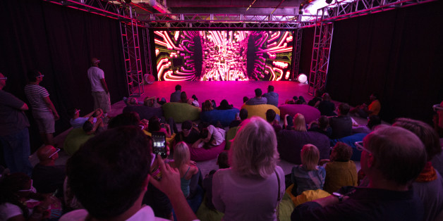 IMAGE DISTRIBUTED FOR RELIANT - People gather for 3D glasses as they wait for the Reliant 3D Light Show to begin at Aurora Dallas, an event powered by Reliant, in Dallas, Tex. on Friday, Oct. 16, 2015. Reliant is dedicated to bringing together the communities it serves through powerful partnerships that illuminate local culture, such as Aurora. (Shannon Faulk/AP Images for Reliant)