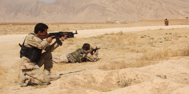 Afghanistan's security forces take their position during a clash by Taliban fighters in the highway between Balkh province to Kunduz city, north of Kabul, Afghanistan, Thursday, Sept. 1, 2015. Acting Defense Minister Masoom Stanekzai says operations to clear the Taliban from Kunduz continue. The insurgents still have a presence in various parts of the city, he said at a press conference. (AP Photo)