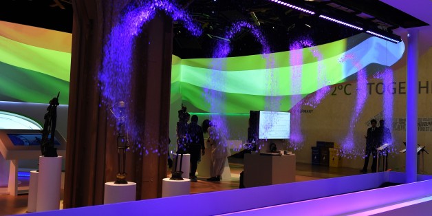 Visitors discover the Indian stand at the COP 21, the United Nations conference on climate change at Le Bourget, on the outskirts of Paris, on December 8, 2015, while water sprays compose the word COP21.The 21st Session of the Conference of the Parties to the United Nations Framework Convention on Climate Change is taking place from November 30 to December 11. / AFP / ALAIN JOCARD (Photo credit should read ALAIN JOCARD/AFP/Getty Images)
