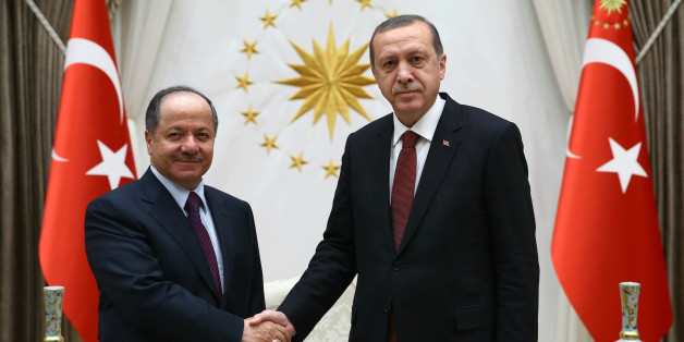 Turkish President Recep Tayyip Erdogan, right, and President of Iraq'a northern Kurdish region, Massoud Barzani, shake hands before a meeting in Ankara, Turkey, Wednesday, Dec. 9, 2015. Turkish Prime Minister Ahmet Davutoglu on Wednesday defended his country's deployment of additional forces to Iraq last week, saying it was an "act of solidarity" with Iraq's fight against the Islamic State group. Turkey has stationed troops at a base outside of the Iraqi city of Mosul since last year as part of a training mission coordinated with the Iraqi government in Baghdad. (AP Photo/Yasin Bulbul, Presidential Press Service, Pool )
