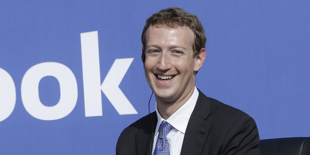 Facebook CEO Mark Zuckerberg smiles while speaking at Facebook in Menlo Park, Calif., Sunday, Sept. 27, 2015. A rare visit by Indian Prime Minister Narendra Modi this weekend has captivated his extensive fan club in the area and commanded the attention of major U.S. technology companies eager to extend their reach into a promising overseas market. (AP Photo/Jeff Chiu)