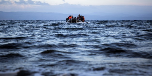 Migrants and refugees approach on a dinghy the northeastern Greek island of Lesbos from the Turkish coast, on Wednesday, Dec. 9, 2015. Greek authorities say in another incident at the southeastern Greek islet of Farmakonissi at least 12 people have died and 26 are missing after a boat carrying about 50 migrants sank in Aegean Sea. (AP Photo/Santi Palacios)