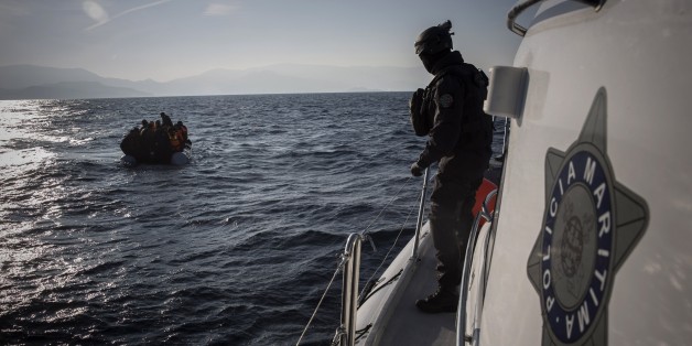 Members of the Frontex, European Border Protection Agency, from Portugal approach a dingy with 56 people, who were lost in an open sea as they try to get to the Greek island of Lesbos, Tuesday, Dec. 8, 2015. In another incident six children have drowned after a rubber dinghy carrying Afghan migrants to Greece sank off Turkey's Aegean coast. Turkey has stepped up efforts to stop migrants from leaving to Greece by sea. (AP Photo/Santi Palacios)