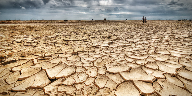 Woman and girl walking on drought.