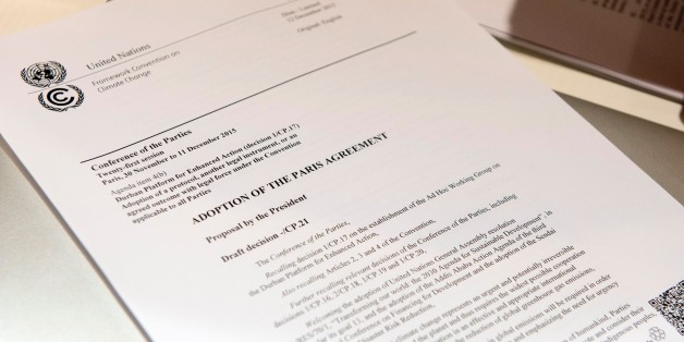 A copy of 'The adoption of the Paris agreement' is pictured after the announcement of the final draft by French Foreign Affairs minister Laurent Fabius at the COP21 Climate Conference in Le Bourget, north of Paris, on December 12, 2015.
The years-long quest for a universal pact to avert catastrophic climate change neared the finish line with conference host France announcing that the final draft had been completed in the early hours of the morning. / AFP / MIGUEL MEDINA (Photo credit should read MIGUEL MEDINA/AFP/Getty Images)