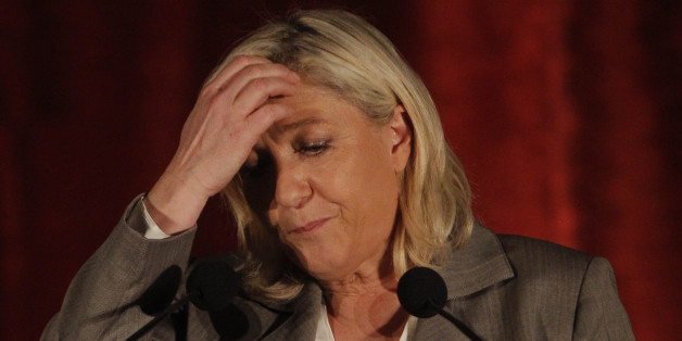 French far right National Front party leader Marine Le Pen gestures as she delivers a speech during a meeting for local elections, in Henin-Beaumont, northern France, Wednesday, March 25, 2015. The second round of French local elections will be held on March 29. (AP Photo/Michel Spingler)