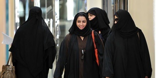 Saudi women walk inside the Faysalia shopping centre in Riyadh